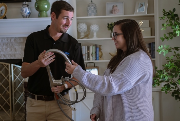 Technician Showing Customer Faucet Technician Showing Customer Faucet