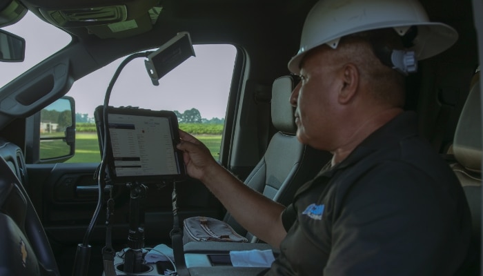 Technician With Ipad In Truck Technician With Ipad In Truck